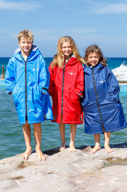 Toasty Ultimate Weatherproof Kids jackets in  aqua red and blue